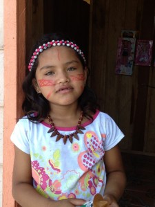 Girl from Amazin village with traditional painted face.