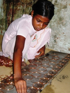 girl making bangles